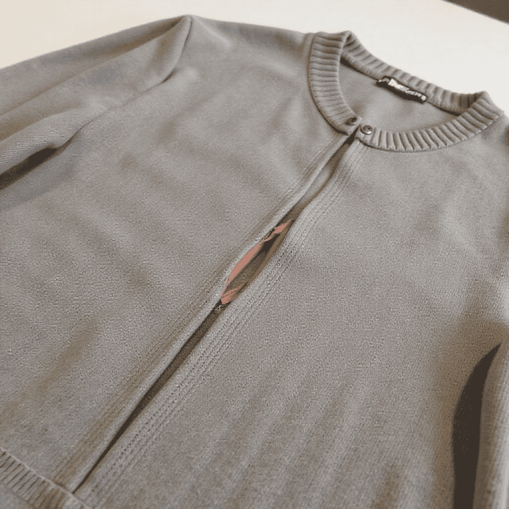 Repaired knit sweater neatly folded